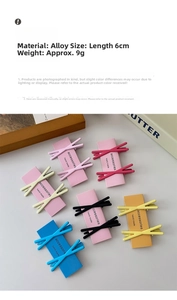 Macro view of colorful macaron alloy crisscross hair clips on a purple display card