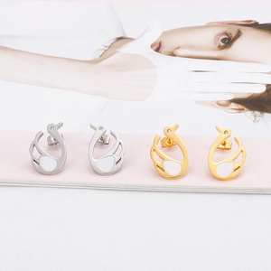 Elegant swan-shaped earrings in gold and silver finish with sparkling rhinestone details