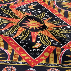 Close-up of bohemian tarot tapestry featuring sun and moon prints on twill fabric