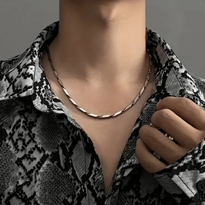 Men's silver stainless steel twisted link chain necklace on a model in snake shirt