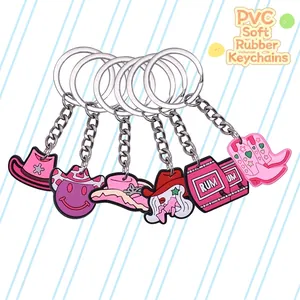 Pink PVC cartoon keychain set featuring Western cowboy hats, boots, and character charms