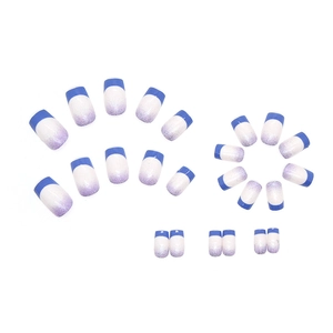 Klein blue French gradient press-on nails with purple glitter finish and white accents