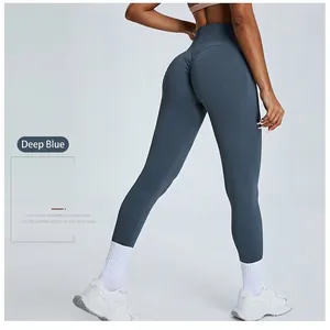 High-waisted navy blue yoga pants with butt-lifting design for fitness and pilates