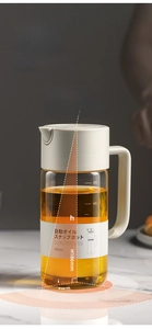 Detailed view of 550ml glass oil bottle with dimensions and gravity flip lid
