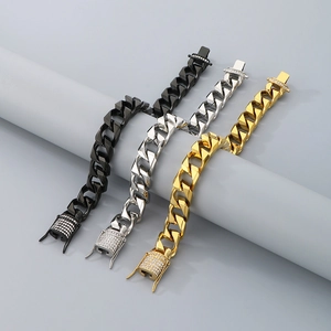 Detailed view of Cuban link bracelets in gold, silver and black with zircon set clasps