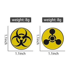 Detail view of biohazard and radiation warning enamel pins with 1.1 inch size dimensions