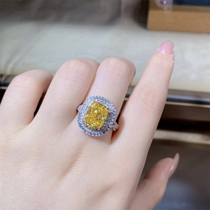Macro shot of S925 sterling silver ring featuring a radiant cut yellow cushion stone