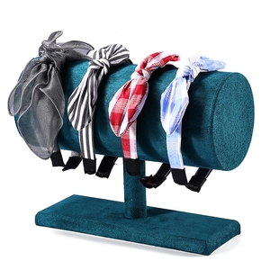 Velvet display stand showing four styles of bow headbands with stripes and plaid patterns