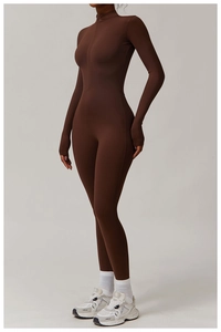 Detail view of the high-collar front zipper and matte fabric of the coffee bodysuit