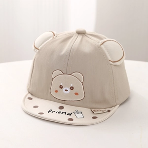 Detail of baby sun hat with teddy bear embroidery and soft polka dot brim detail