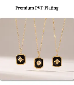 Detail of PVD gold plated square pendants with black acrylic inlay and star diamond