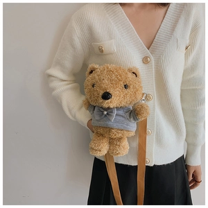 Cute brown plush teddy bear crossbody bag shown on model with a grey hoodie and strap