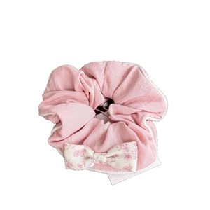 Pink floral bow hair tie with ruffled fabric and pearl accents in French pastoral style