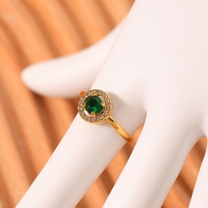 Gold-plated adjustable ring with emerald zircon and halo diamonds on a model hand