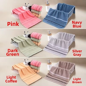 Detail of absorbent cotton towels in six colors with a soft honeycomb texture and stripe trim