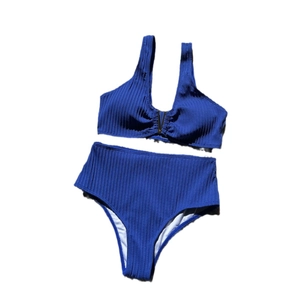 Two-piece royal blue ribbed bikini set with high waist bottom and gold V-neck hardware