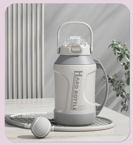 Detailed view of white 316 stainless steel sports bottle with handle and matte texture
