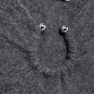 Dark grey knit mini dress featuring unique hollow neckline and silver metal ball accents
