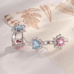 Silver drop earrings with heart blue and star pink zircon pendants on leaf paper