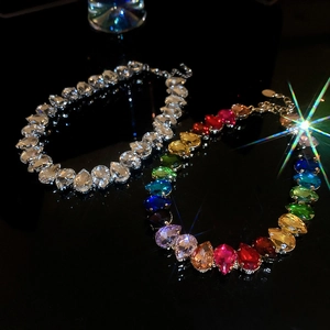 Luxury teardrop crystal necklace with sparkling white and iridescent stones on black