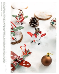 Christmas airplane ornament with Santa and reindeer on snowy decorative background