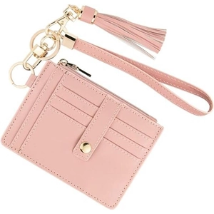 Pink leather card holder wallet with tassel keychain and wristlet on white background