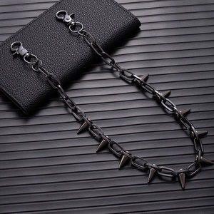 Gunmetal spiked wallet chain with metal punk rock style link displayed on textured leather