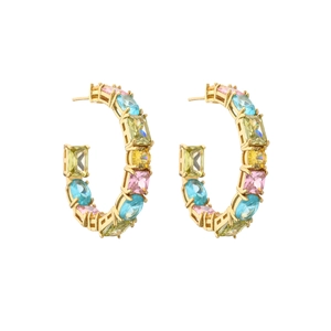 Detailed shot of gold C-shaped earrings set with colorful geometric cubic zirconia gems