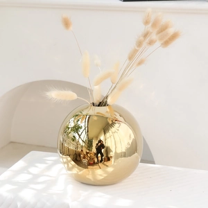 Modern gold electroplated ceramic sphere vase with dried bunny tail grass for home decor