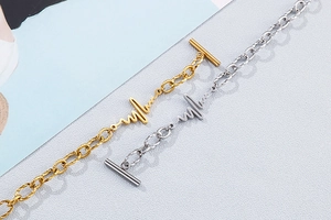 Detailed view of lifeline heartbeat bracelets with OT toggles in gold and silver finish