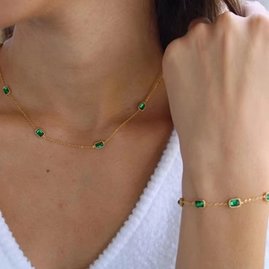 Elegant gold-plated stainless steel jewelry set featuring emerald-cut green zircon stones