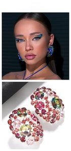 Detail view of large vintage-style colorful rhinestone cluster earrings for women