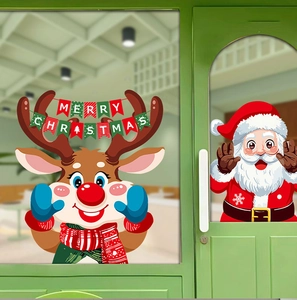 Detail of Santa Claus and cartoon reindeer static stickers on a glass window for Christmas
