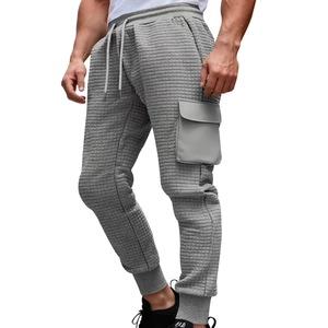 Men's light grey waffle knit cargo sweatpants with drawstring waist and pockets