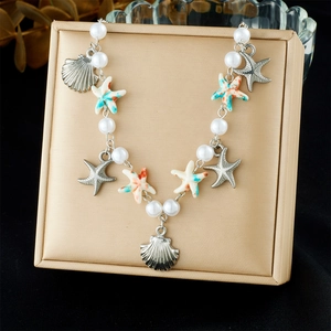 Ocean style necklace with white pearls, silver shells and colorful starfish charms