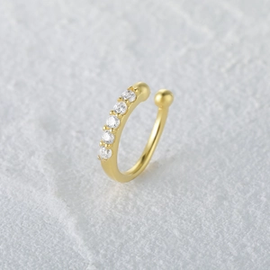 Detail view of gold S925 sterling silver nose cuff set with six round zircon stones