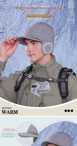 Detail of warm grey winter knit hat with thickened fleece lining and ear protection flaps