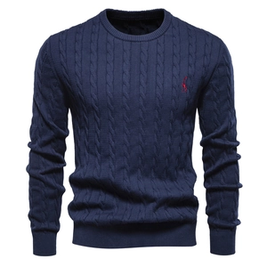 Detailed view of navy blue cable knit sweater with red giraffe embroidery on chest