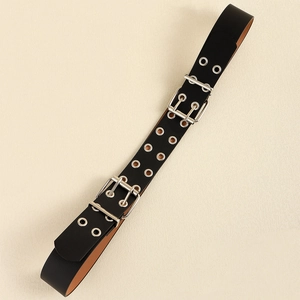 Close-up of black leather belt with double buckle and multiple metal eyelets