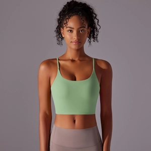 Close-up of mint green high-impact sports bra with thin straps and breathable fabric