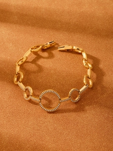 Macro shot of 18K gold plated heart bracelet with 5A zircons on premium velvet