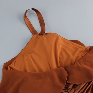 Detail of caramel halter neckline with rose ruffle and elegant chiffon fabric texture