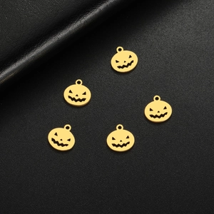 Set of five golden pumpkin head pendants with hollowed face for DIY jewelry making