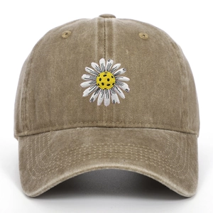 Detailed close-up of daisy embroidery on vintage washed cotton khaki baseball cap