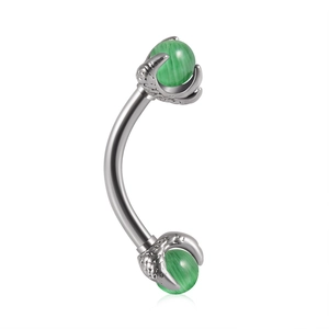Detailed close-up of a silver curved barbell with green cat-eye beads in claw settings