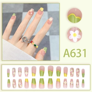 Floral press-on nails set with yellow and green daisy patterns on pink base