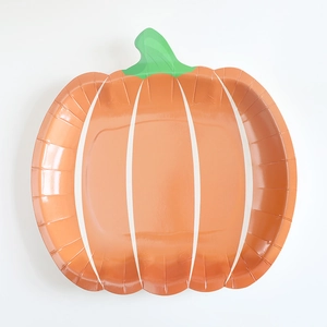 Top view of pumpkin shaped disposable paper plate in orange for Thanksgiving decor
