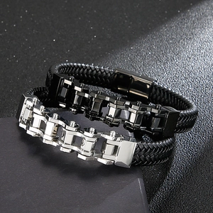 Detail of woven leather bracelets with stainless steel bike chain design and magnetic clasps
