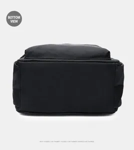 Detailed bottom view of the black Oxford fabric backpack showing neat stitching and texture
