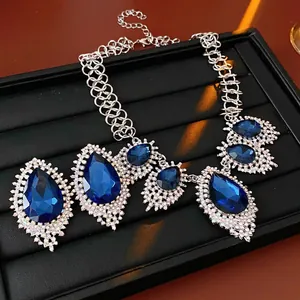 French vintage luxury necklace with large blue teardrop crystals and pavé diamonds